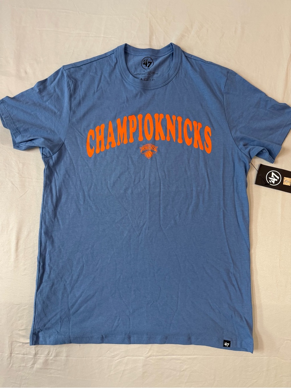 47 Men's Knicks Blue Tee with Bold Orange Logo